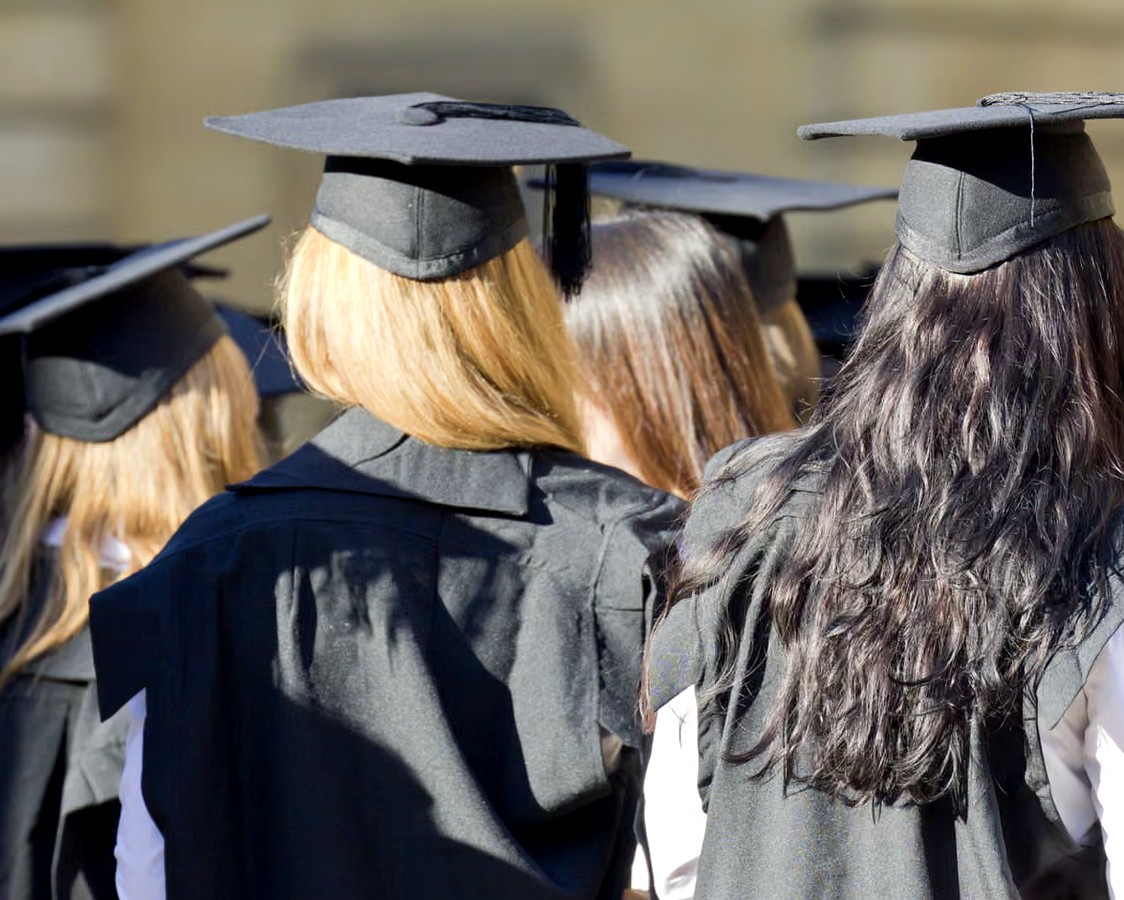 A group of university students walking on campus